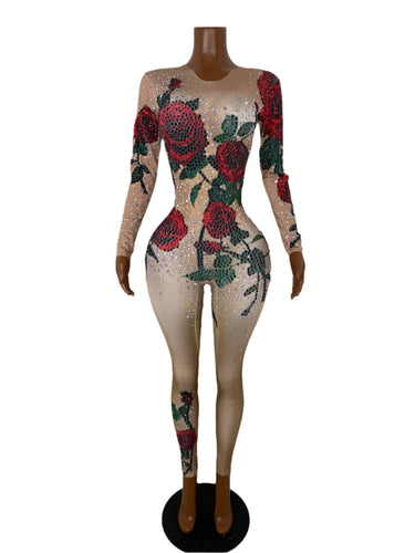 Mannequin wearing a bodysuit with floral designs and sequins on a white background
